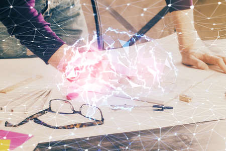 Man's hands withbrain double exposure drawing. Concept of human learning.の写真素材