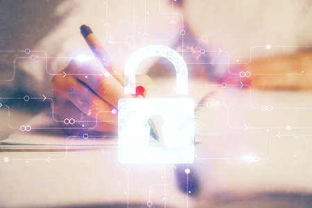 Double exposure of hands making notes with lock icons. Concept security and protection of data