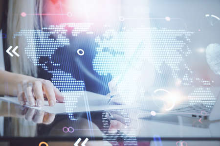 Multi exposure of hands making notes with world map hologram and data theme icons. Concept of global...