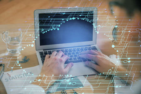 Businessman with computer background with technology theme hologram. Concept of big data. Double...
