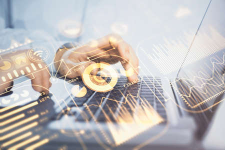 Technology theme hologram with man working on computer on background. High tech concept. Double...