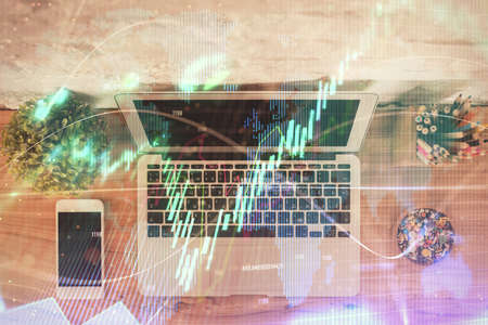 Multi exposure of financial chart drawing over table background with computer. Concept of research....