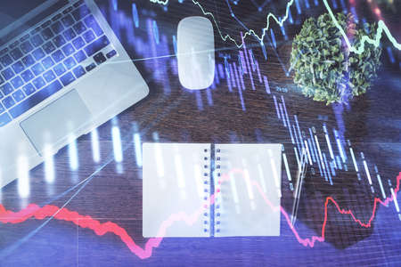Stock market graph and top view computer on the table background. Double exposure. Concept of...