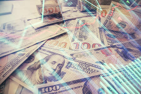 Multi exposure of forex chart drawing over us dollars bill background. Concept of financial success markets.の写真素材