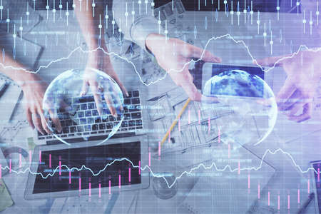 Multi exposure of man and woman working together and forex graph hologram drawing. Financial...