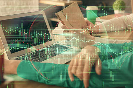 Double exposure of man and woman working together and forex chart hologram. Business concept....