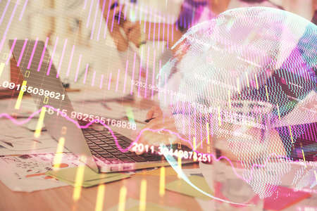 Multi exposure of woman hands typing on computer and forex chart hologram drawing. Stock market...