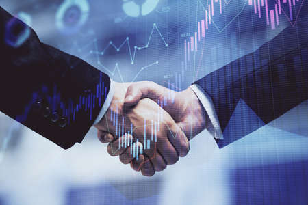 Double exposure of forex graph hologram and handshake of two men. Stock market concept.