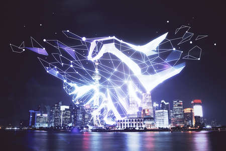 Double exposure of handshake hologram over city view background. Concept of partnership.の写真素材