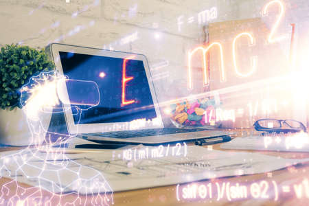 Desktop computer background and formula hologram writing. Double exposure. Education concept.