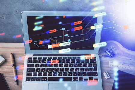 Double exposure of desktop computer and technology theme hologram. Concept of software development.の写真素材