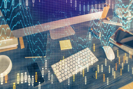 Multi exposure of chart and financial info and work space with computer background. Concept of...