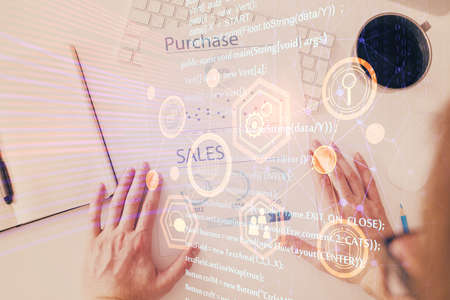 Man's hands with tech theme multi exposure icons. Concept of big data and technology.