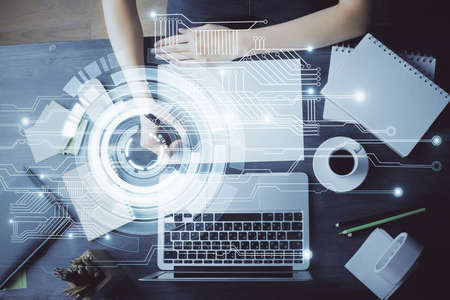 Multi exposure of writing hands on background with data solution hologram. Technology concept.の写真素材