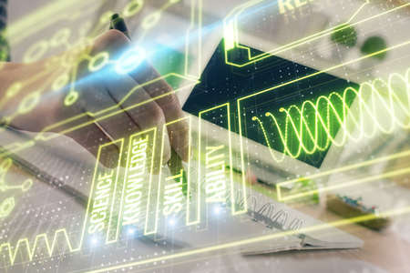 Education theme hologram over woman's hands writing background. Concept of study. Double exposure