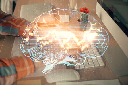 Man typing on keyboard background with brain hologram. Concept of big Data. Double exposure.