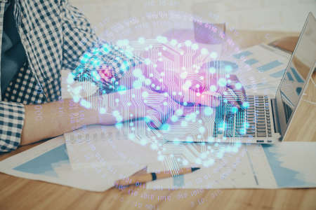 Man typing on keyboard background with brain hologram. Concept of big Data. Double exposure.