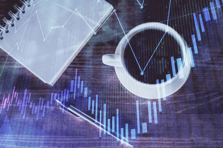 Double exposure of forex graph drawing and work table top veiw. Concept of financial analysis.の写真素材