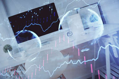 Double exposure of financial graph drawing and office interior background. Concept of stock market.