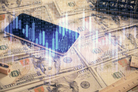 Double exposure of forex graph drawing over us dollars bill background. Concept of financial markets.の写真素材