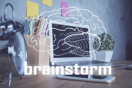 Desktop computer background in office and start up theme hologram drawing. Double exposure. Startup concept.の写真素材