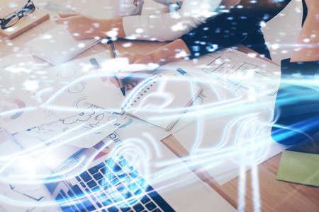 Tech autopilot theme hologram over woman's hands taking notes background. Concept of hightech....