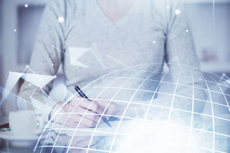 Multi exposure of hands making notes with world map hologram and data theme icons. Concept of global computer data.の写真素材