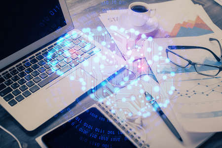 Double exposure of desktop with computer and brain drawing hologram. Artificial intelligence...