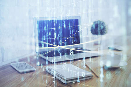 Double exposure of laptop computer and technology theme hologram. Concept of freelance work.