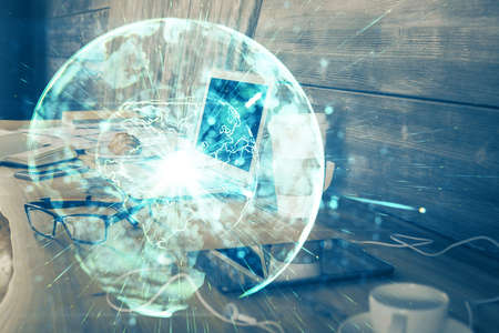 Multi exposure of business theme icons and work space with computer background. Concept of success.