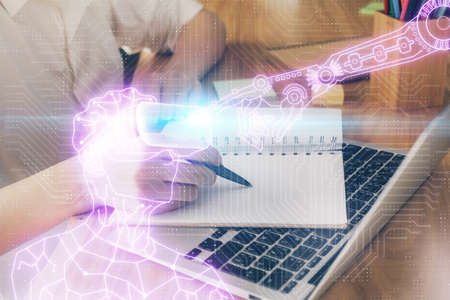 AR hologram over woman's hands taking notes background. Concept of augmented reality. Multi exposure