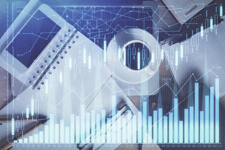 Double exposure of financial graph hologram over desktop with phone. Top view. Mobile trade platform...