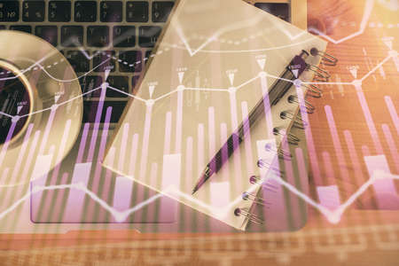 Multi exposure of forex chart drawing and work table top veiw. Concept of financial analysis.