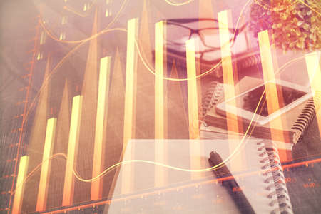 Double exposure of forex chart drawing and cell phone background. Concept of financial trading