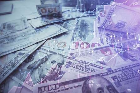 Multi exposure of forex chart drawing over us dollars bill background. Concept of financial success...