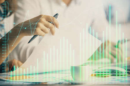 Double exposure of forex graph drawing over people taking notes background. Concept of financial...