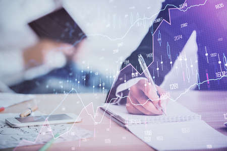 Double exposure of forex chart drawing over people taking notes background. Concept of financial...