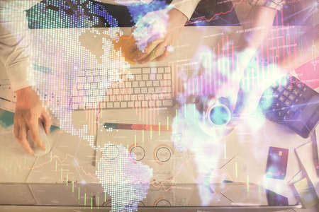 Double exposure of man and woman working together and financial chart hologram drawing. market...