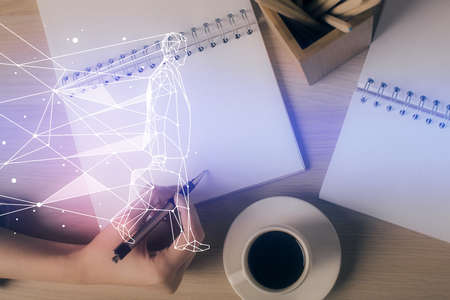 Start up creative drawing over close up hands in notepad background. Concept of brainstorming. Double exposureの写真素材