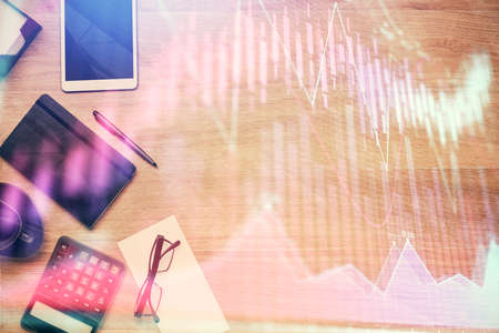 Double exposure of forex graph drawing and work table top veiw. Concept of financial analysis.