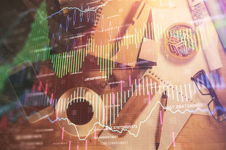 Double exposure of forex graph drawing and work table top veiw. Concept of financial analysis.の写真素材