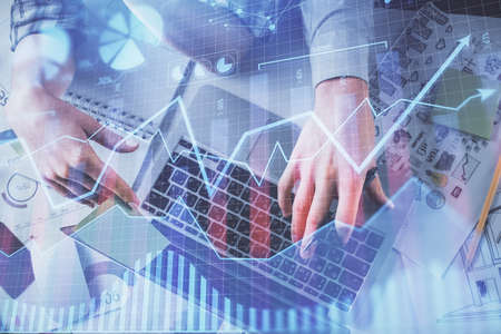Double exposure of man and woman working together and forex graph hologram drawing. Financial...