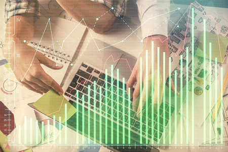 Double exposure of man and woman working together and forex graph hologram drawing. Financial...