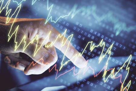 Multi exposure of man's hands holding and using a phone and financial chart drawing. Market analysis...