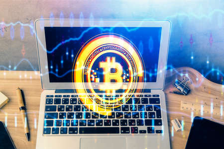 Double exposure of blockchain theme hologram and table with computer background. Concept of bitcoin...