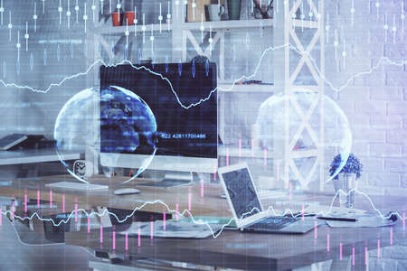 Financial chart drawing and table with computer on background. Double exposure. Concept of...