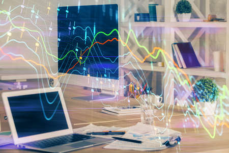 Financial graph colorful drawing and table with computer on background. Multi exposure. Concept of...