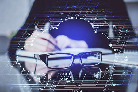 Double exposure of writing hands on background with data solution hologram on front. Technology...