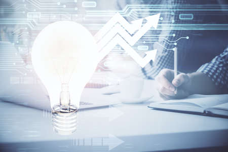 Growing arrows with businessman working on computer on background. Success concept. Double exposure.の写真素材