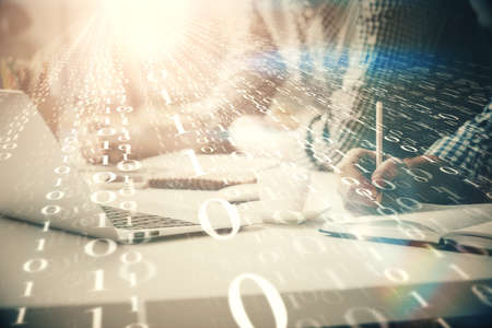 Businessman with computer background with technology theme hologram. Concept of hightech. Multi exposure.の写真素材